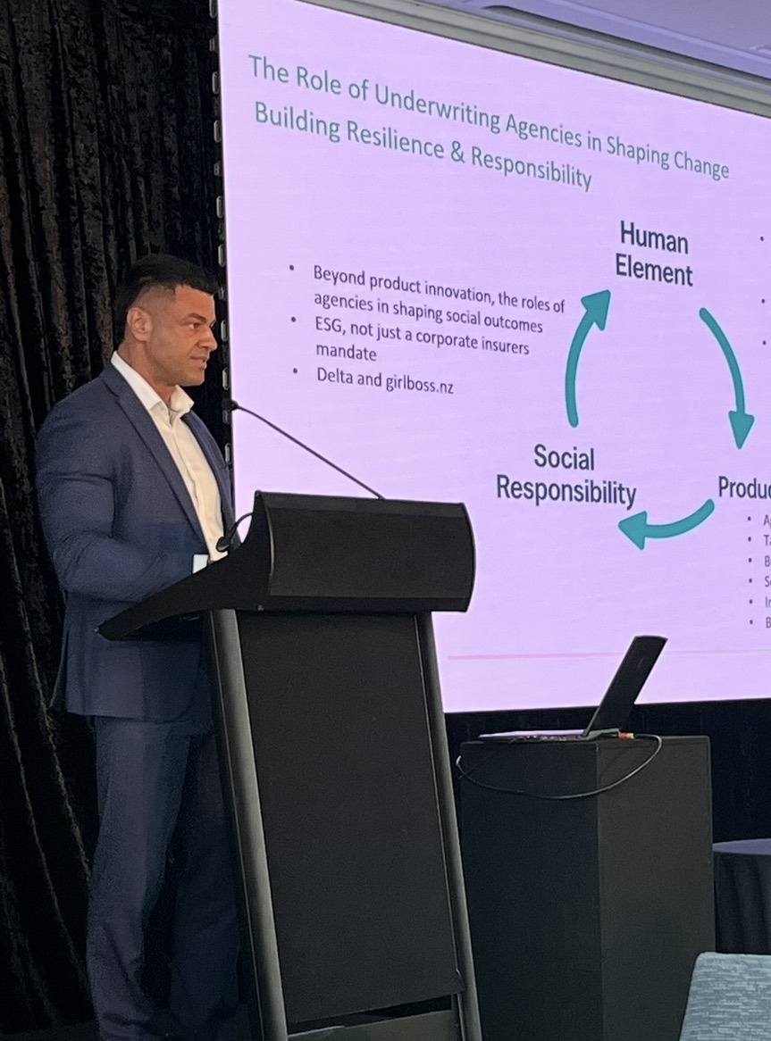 Dave presenting at a podium at a professional conference